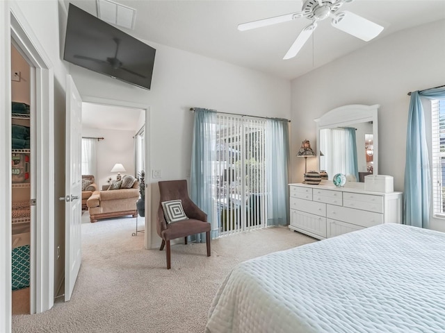 1713 Jadestone Ter, The Villages, FL 32162 - bedroom with light carpet, multiple windows, lofted ceiling, and a ceiling fan