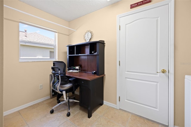 office with baseboards and tile patterned flooring