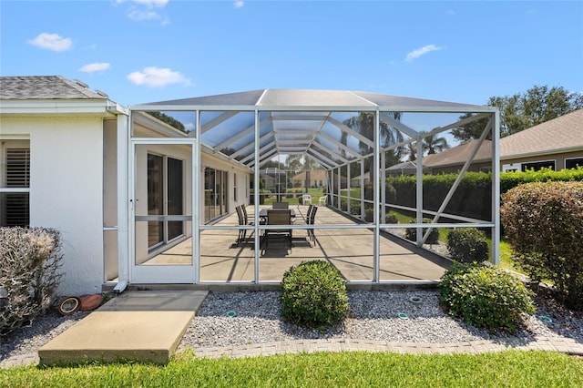 view of patio with a lanai