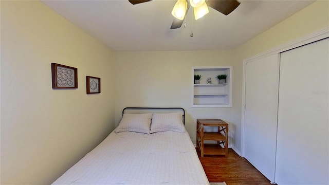 bedroom featuring wood finished floors, a closet, and ceiling fan