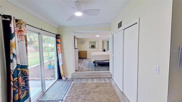 corridor featuring light wood finished floors