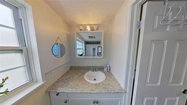 bathroom with vanity and a textured ceiling