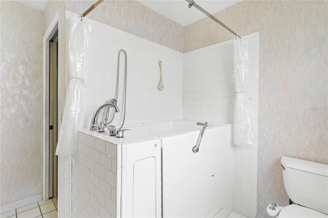 735 Palma Dr, The Villages, FL 32159 - bathroom with toilet, wallpapered walls, and tile patterned flooring