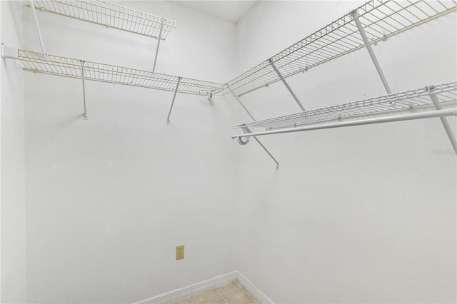 735 Palma Dr, The Villages, FL 32159 - spacious closet with tile patterned flooring