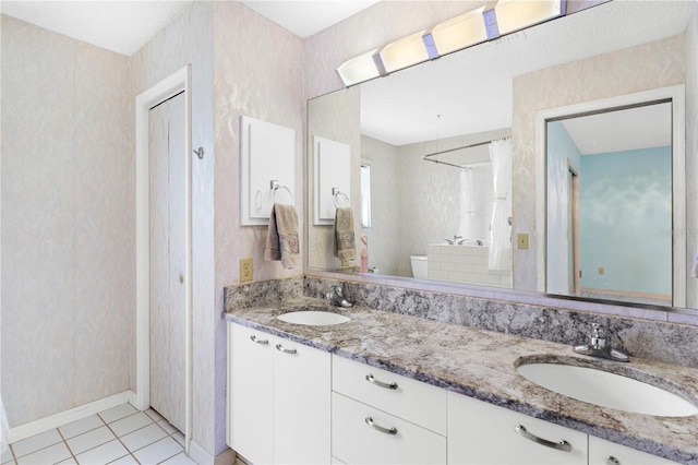 735 Palma Dr, The Villages, FL 32159 - bathroom with double vanity, a shower with curtain, tile patterned flooring, toilet, and baseboards