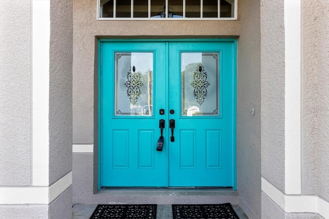 915 N Fox Meadow Ter, Crystal River, FL 34429 - property entrance with french doors and stucco siding