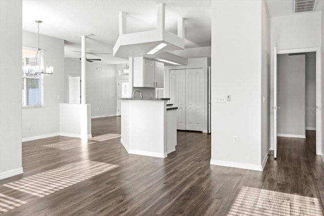 915 N Fox Meadow Ter, Crystal River, FL 34429 - kitchen featuring a chandelier, dark wood-style flooring, baseboards, a ceiling fan, and pendant lighting