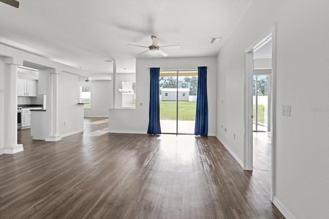 915 N Fox Meadow Ter, Crystal River, FL 34429 - unfurnished living room featuring ceiling fan, dark wood-style flooring, and baseboards