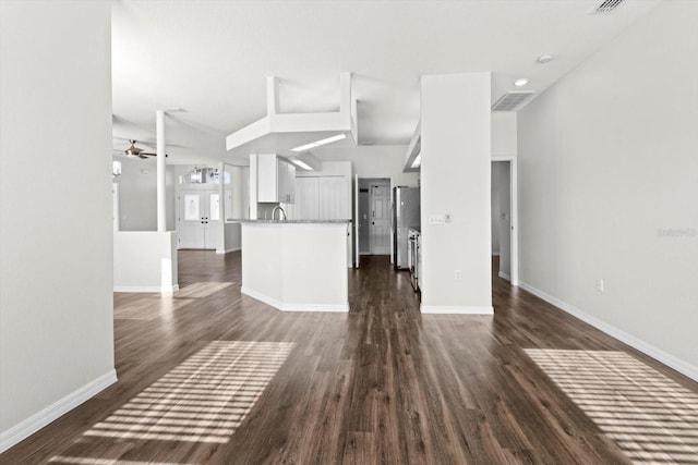 915 N Fox Meadow Ter, Crystal River, FL 34429 - unfurnished living room with a ceiling fan, dark wood-style floors, baseboards, and a sink