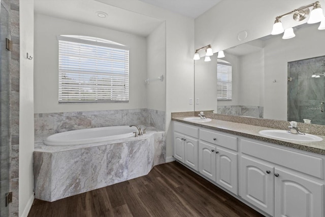 915 N Fox Meadow Ter, Crystal River, FL 34429 - full bath with a shower stall, a bath, wood finished floors, and double vanity