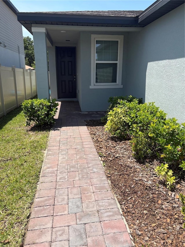1808 Carnostie Rd, Winter Haven, FL 33884 - entrance to property featuring stucco siding and fence