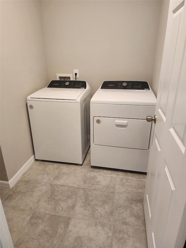 1808 Carnostie Rd, Winter Haven, FL 33884 - laundry room with independent washer and dryer and baseboards