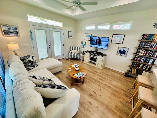 12077 Lakeshore Way, Oxford, FL 34484 - living area featuring a ceiling fan, french doors, light wood finished floors, and baseboards