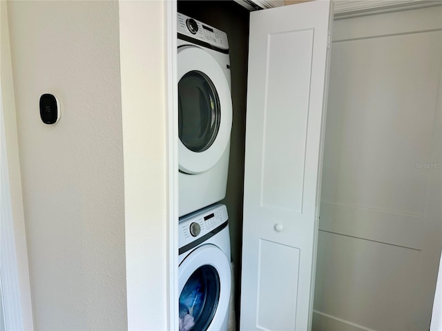 12077 Lakeshore Way, Oxford, FL 34484 - washroom with stacked washer / dryer