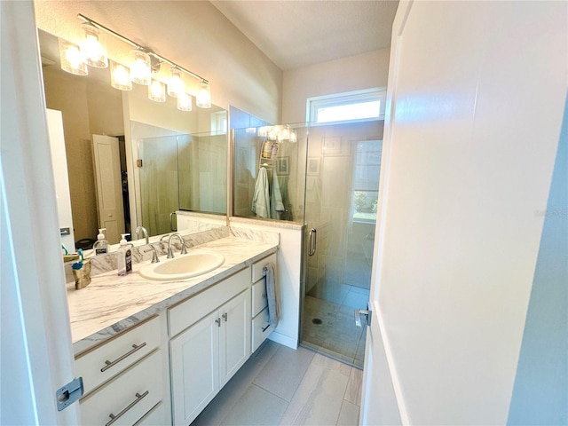 12077 Lakeshore Way, Oxford, FL 34484 - bathroom featuring vanity, a stall shower, and tile patterned floors