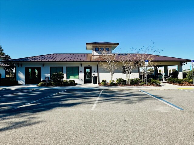 12077 Lakeshore Way, Oxford, FL 34484 - view of building exterior featuring uncovered parking