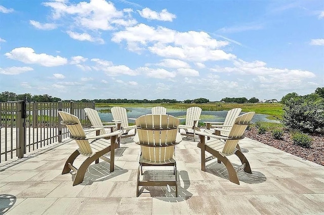12077 Lakeshore Way, Oxford, FL 34484 - view of patio with a water view and an outdoor fire pit