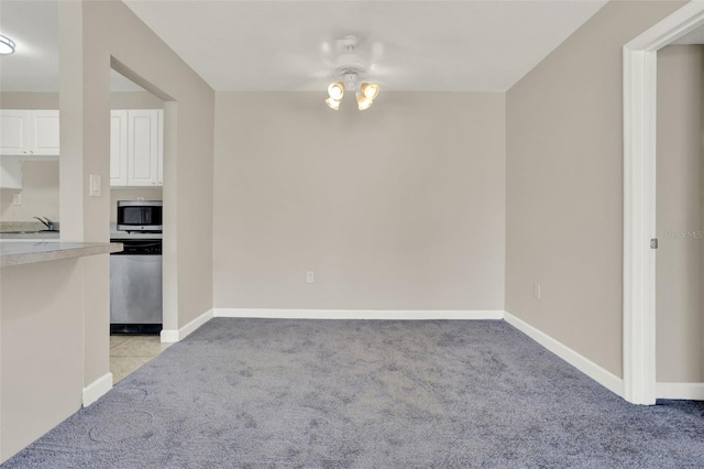 2423 Branch Way Unit 207, Maitland, FL 32751 - unfurnished dining area with light carpet and baseboards