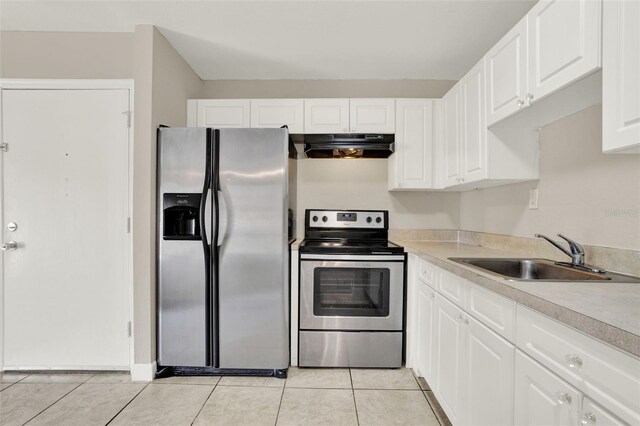 2423 Branch Way Unit 207, Maitland, FL 32751 - kitchen with appliances with stainless steel finishes, under cabinet range hood, a sink, and light tile patterned flooring
