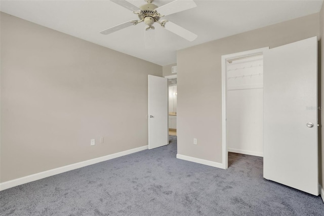 2423 Branch Way Unit 207, Maitland, FL 32751 - unfurnished bedroom featuring carpet floors, a walk in closet, baseboards, ceiling fan, and a closet