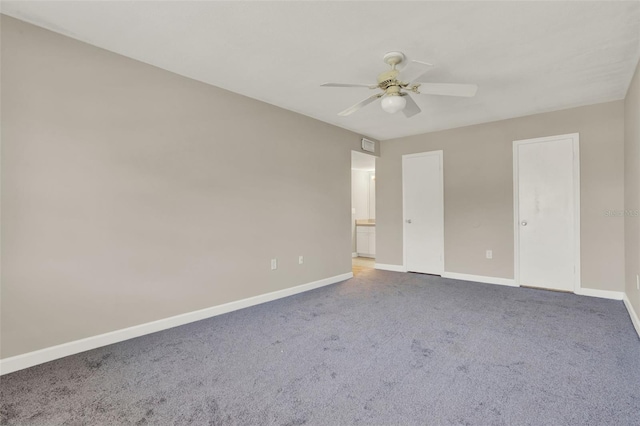 2423 Branch Way Unit 207, Maitland, FL 32751 - unfurnished bedroom featuring baseboards, carpet, a ceiling fan, and connected bathroom