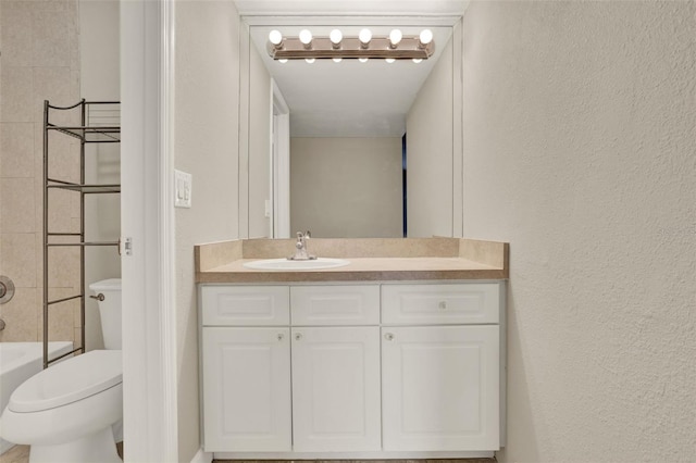 2423 Branch Way Unit 207, Maitland, FL 32751 - full bath featuring vanity, toilet, a textured wall, and tub / shower combination