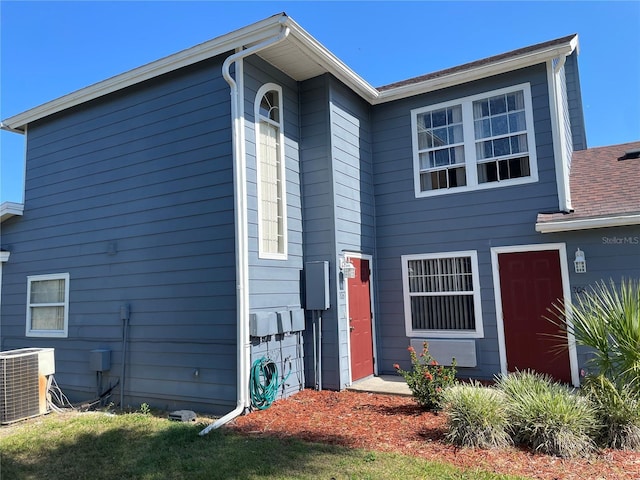 206 Orchid Dr, Davenport, FL 33897 - rear view of house with central air condition unit