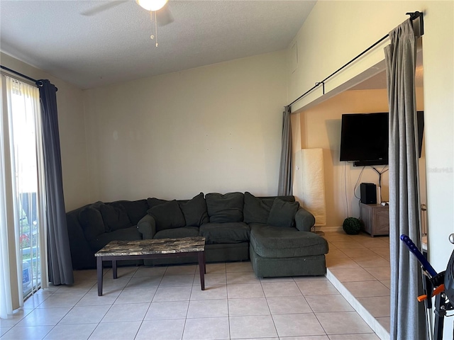 206 Orchid Dr, Davenport, FL 33897 - living area featuring a ceiling fan, light tile patterned floors, and a textured ceiling