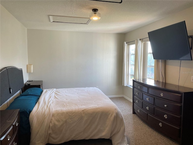 206 Orchid Dr, Davenport, FL 33897 - bedroom featuring attic access, light colored carpet, baseboards, and a textured ceiling