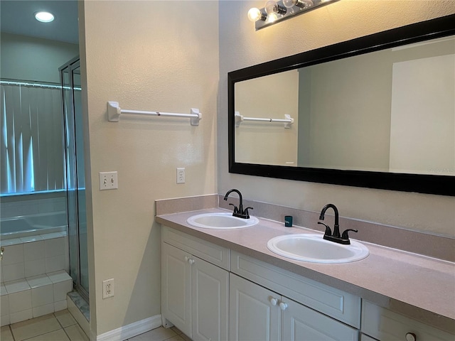 206 Orchid Dr, Davenport, FL 33897 - bathroom featuring tile patterned floors, double vanity, an enclosed shower, and a bathtub