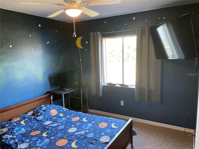 206 Orchid Dr, Davenport, FL 33897 - bedroom with carpet flooring, baseboards, and a ceiling fan
