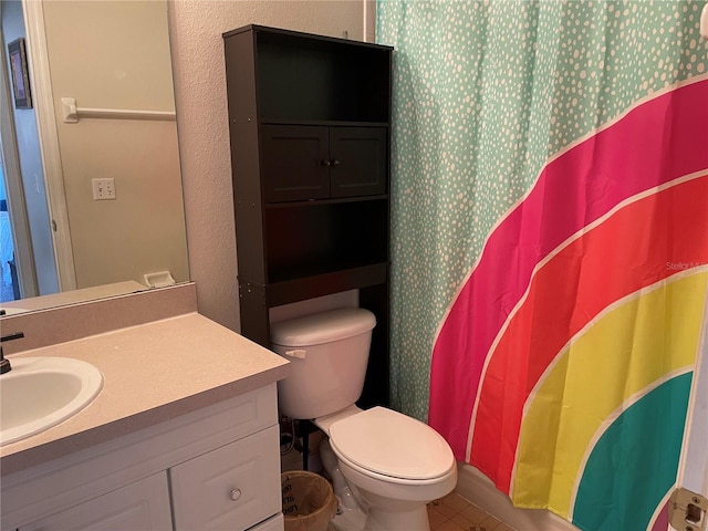 206 Orchid Dr, Davenport, FL 33897 - bathroom featuring vanity, toilet, tile patterned floors, and curtained shower