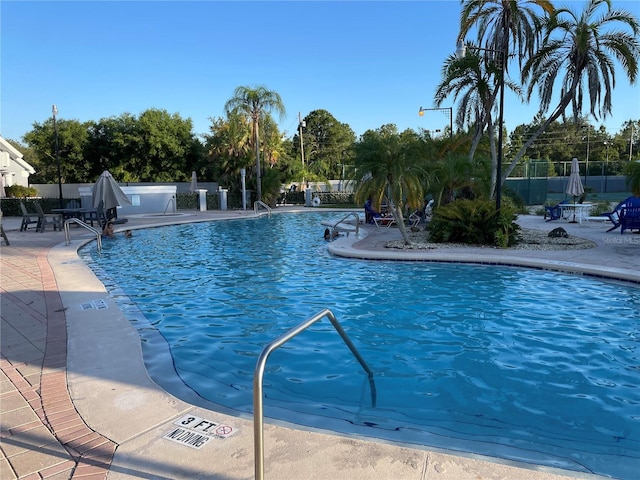 206 Orchid Dr, Davenport, FL 33897 - community pool featuring a patio area