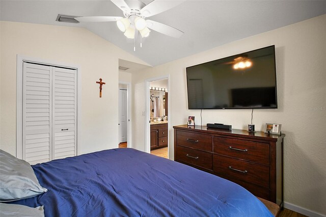 1204 Monterey Dr, Eustis, FL 32726 - bedroom featuring lofted ceiling, light wood-style flooring, a ceiling fan, a closet, and ensuite bathroom