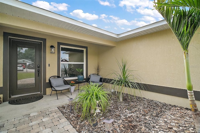 1204 Monterey Dr, Eustis, FL 32726 - view of exterior entry with stucco siding