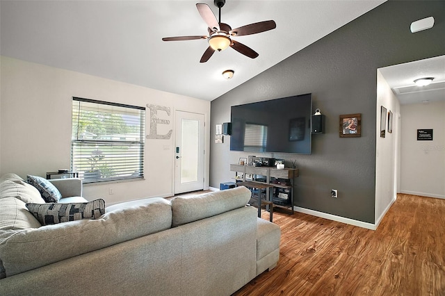 1204 Monterey Dr, Eustis, FL 32726 - living room featuring lofted ceiling, a ceiling fan, wood finished floors, and baseboards