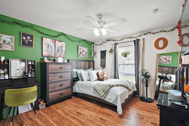 1204 Monterey Dr, Eustis, FL 32726 - bedroom featuring wood finished floors, a textured ceiling, and a ceiling fan