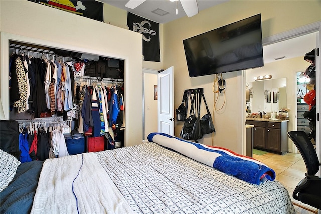 1204 Monterey Dr, Eustis, FL 32726 - bedroom featuring a closet, light tile patterned floors, and ensuite bathroom