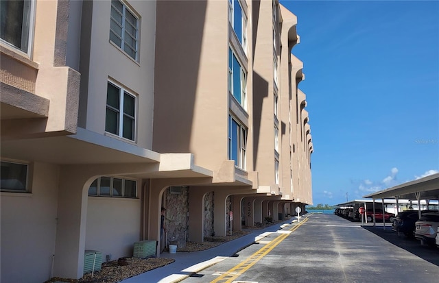 632 Edgewater Dr Unit 832, Dunedin, FL 34698 - view of property featuring covered parking