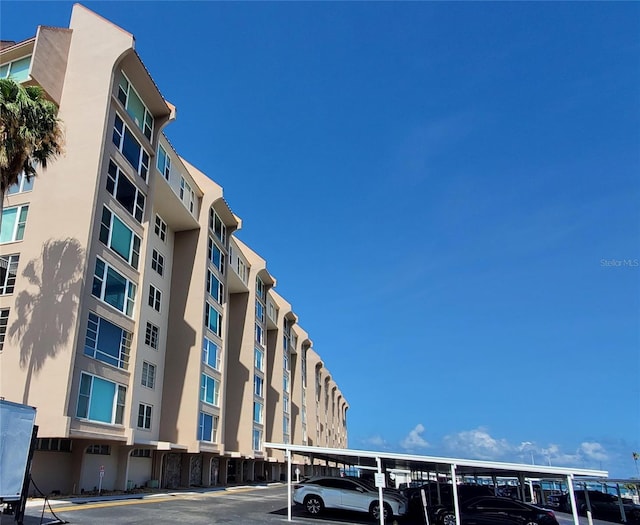 632 Edgewater Dr Unit 832, Dunedin, FL 34698 - view of apartment building / complex featuring covered parking