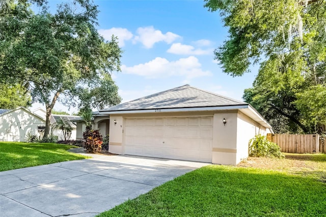 2711 Bayview Dr, Eustis, FL 32726 - ranch-style house with stucco siding, a garage, driveway, and a shingled roof