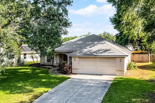 2711 Bayview Dr, Eustis, FL 32726 - ranch-style house featuring stucco siding, a shingled roof, an attached garage, and concrete driveway