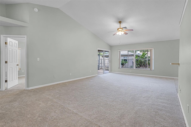 2711 Bayview Dr, Eustis, FL 32726 - empty room featuring a ceiling fan, high vaulted ceiling, light colored carpet, and baseboards