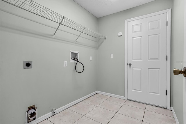 2711 Bayview Dr, Eustis, FL 32726 - laundry area with hookup for a washing machine, electric dryer hookup, baseboards, light tile patterned flooring, and hookup for a gas dryer