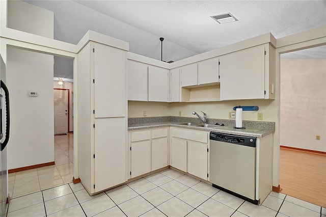 501 Cherry Tree St, Eustis, FL 32726 - kitchen with dishwashing machine, a sink, baseboards, light tile patterned floors, and light countertops