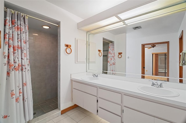 501 Cherry Tree St, Eustis, FL 32726 - full bath with double vanity, a tile shower, tile patterned flooring, and ceiling fan