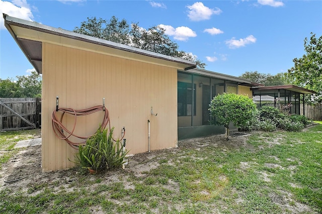 501 Cherry Tree St, Eustis, FL 32726 - view of side of property featuring a sunroom