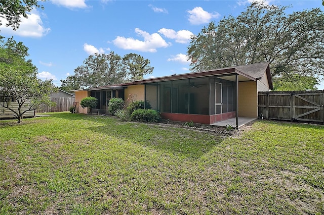 501 Cherry Tree St, Eustis, FL 32726 - back of house with a sunroom