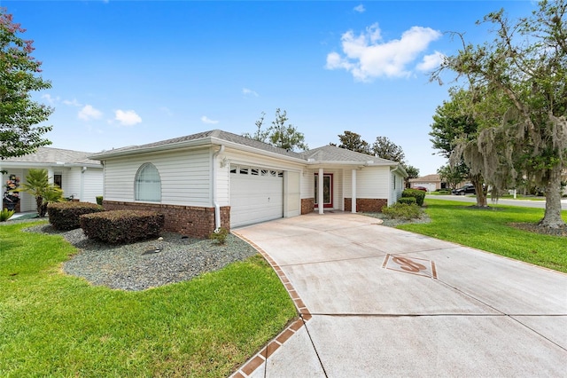 8608 SE 141st Street Rd, Summerfield, FL 34491 - ranch-style house featuring brick siding, driveway, an attached garage, and a front yard