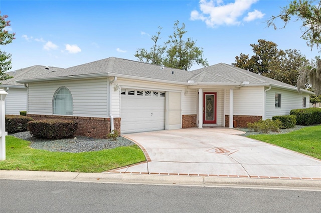8608 SE 141st Street Rd, Summerfield, FL 34491 - ranch-style home with brick siding, an attached garage, and concrete driveway